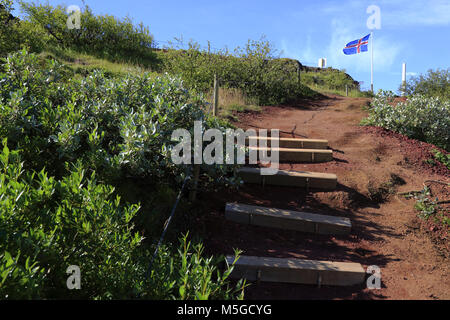 Walking trail connecting Keride Crater and visitor center at Kerid Crate r with Iceland national flag.Golden Circle.Grimsnes.South Iceland.Iceland Stock Photo