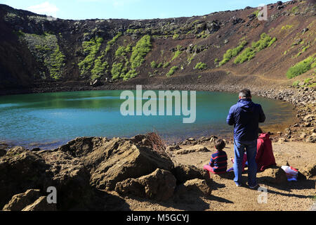 Visitors on the bottom of Kerid Crater by the crater lake.Golden Circle.South Iceland.Iceland Stock Photo