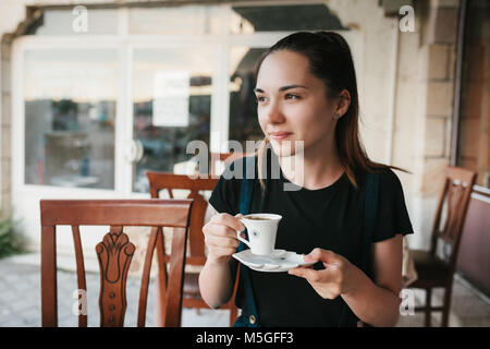 Beautiful woman drinking coffee at the cafe Stock Photo