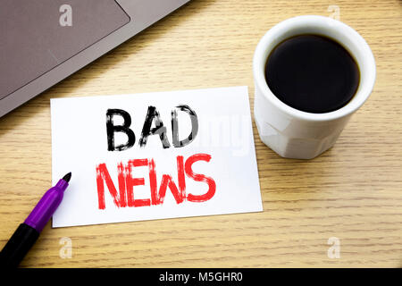 Handwriting Announcement text showing Bad News. Business concept for Failure Media Newspaper written on notebook book on wooden background in the Offi Stock Photo