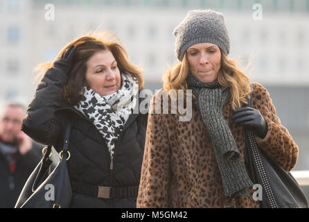 People in winter coats and scarves cross Waterloo Bridge, in central London, as freezing air from Russia is to grip the UK in what is set to be the coldest late February in five years. Stock Photo