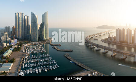 Panorama of Busan city skyline view at Haeundae district, Gwangalli Beach with yacht pier at Busan, South Korea. Stock Photo