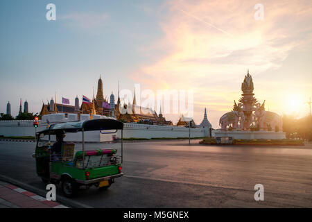 Tuk-tuk for passenger cars To go sightseeing around the Grand Palace in Bangkok with sunset sky background Stock Photo