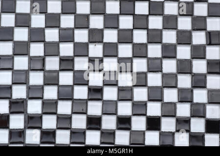 Black and white glass tile checkerboard closeup texture Stock Photo