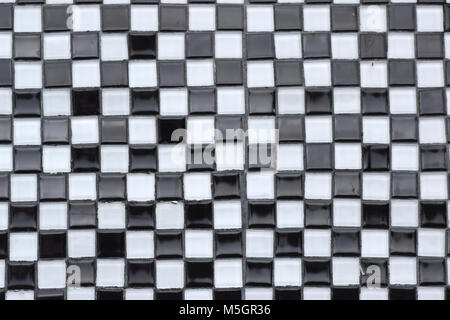 Black and white glass tile checkerboard closeup texture Stock Photo