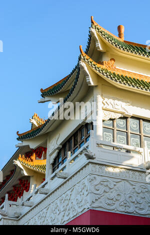 View of the chinese-inspired architecture of the Huatian Chinagora hotel complex with curved roof corners and traditional glazed roof tiles. Stock Photo