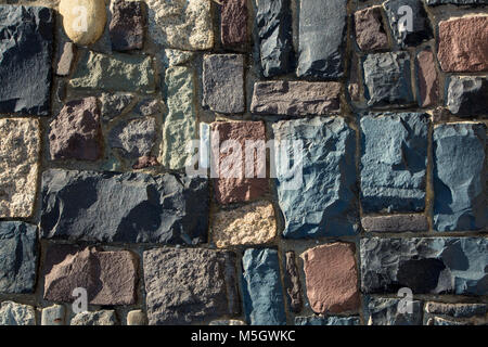 Colored cobblestone wall texture. Stock Photo