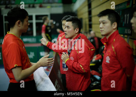 London, UK. 23rd Feb, 2018. Coach Liu Guozheng (2nd R) speaks with Ma Long of China (1st L) as he competes against Ruwen Filus of Germany in the quarterfinals during the ITTF Team World Cup at the Copper Box Arena in London, Britain on Feb. 23, 2018. China won 3-0 and advanced to the semifinal. Credit: Tim Ireland/Xinhua/Alamy Live News Stock Photo