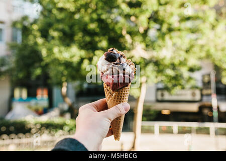 Female hand with ice cream. Delicious food, dessert Stock Photo