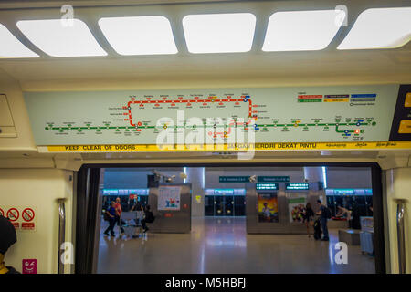 SINGAPORE, SINGAPORE - JANUARY 30, 2018: Indoor view of informative sign of train stops view from inside of Mass Rapid Transit MRT train through the c Stock Photo