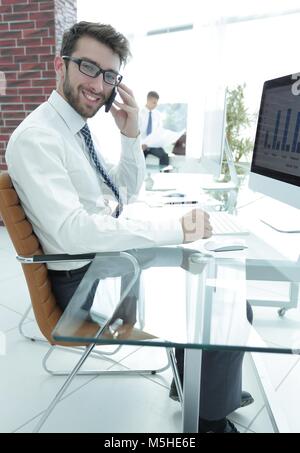 Manager communicates with the customer on the smartphone Stock Photo ...