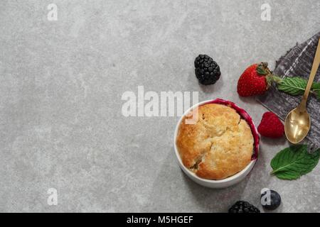 Homemade Mixed Berry Cobbler with copy space top down view Stock Photo