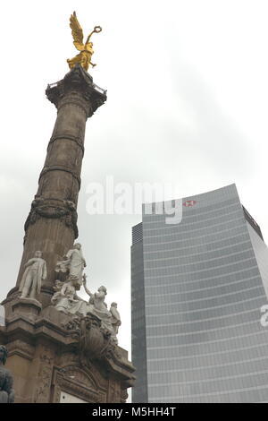 HSBC Bank building in Mexico City, Mexico, overlooks the Angel of Independence Monument located in the heart of the city of Paseo de la Reforma. Stock Photo