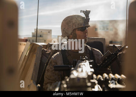 Pfc. Jacob Bonczkowski, machine gunner, 3rd Battalion, 7th Marine Regiment, observes the surrounding area at Range 220 aboard the Marine Corps Air Ground Combat Center, Twentynine Palms, Calif., Feb. 9, 2018 as part of Integrated Training Exercise 2-18. The purpose of ITX is to create a challenging, realistic training environment that produces combat-ready forces capable of operating as an integrated MAGTF. (U.S. Marine Corps Stock Photo