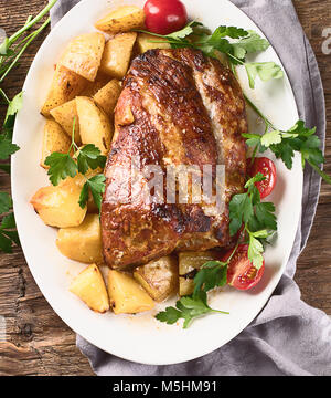 Roasted pork with potatoes. Top view Stock Photo