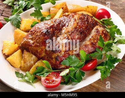 Roasted pork with potatoes. Top view Stock Photo