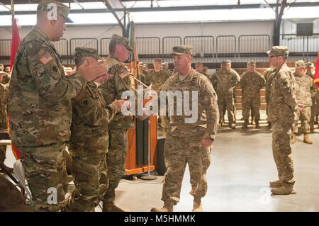 Oklahoma Army National Guard State Command Sergeant Major, Command Sgt. Maj. Tony Riggs, shakes hands with Col. Chris Chomosh, incoming commander of the 45th Infantry Brigade Combat Team, after his speech at the change of command ceremony at Camp Gruber, Oklahoma, Feb. 11. (U.S. Army National Guard Stock Photo