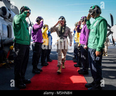 ARABIAN GULF (Feb. 12, 2018) Sideboys render honors to Lt. Gen. William Beydler, Commander, Marine Corps Forces Central Command on the flight deck of the aircraft carrier USS Theodore Roosevelt (CVN 71). Theodore Roosevelt and its carrier strike group are deployed to the U.S. 5th Fleet area of operations in support of maritime security operations to reassure allies and partners and preserve the freedom of navigation and the free flow of commerce in the region. (U.S. Navy Stock Photo