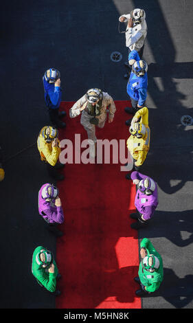 ARABIAN GULF (Feb. 12, 2018) Lt. Gen. William Beydlar, Commander, Marine Corps Forces Central Command, salutes the sideboys on the flight deck of the aircraft carrier USS Theodore Roosevelt (CVN 71). Theodore Roosevelt and its carrier strike group are deployed to the U.S. 5th Fleet area of operations in support of maritime security operations to reassure allies and partners and preserve the freedom of navigation and the free flow of commerce in the region. (U.S. Navy Stock Photo