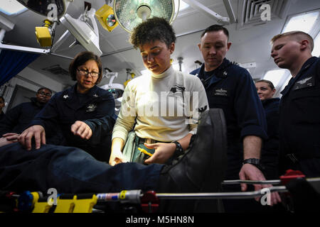 ARABIAN GULF (Feb. 12, 2018) Logistics Specialist 2nd Class Nadia Poitier wraps a simulated fracture during first-aid training aboard the aircraft carrier USS Theodore Roosevelt (CVN 71). Theodore Roosevelt and its carrier strike group are deployed to the U.S. 5th Fleet area of operations in support of maritime security operations to reassure allies and partners and preserve the freedom of navigation and the free flow of commerce in the region. (U.S. Navy Stock Photo