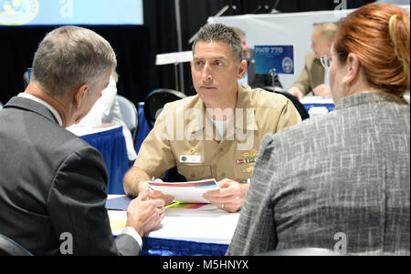 SAN DIEGO (Feb. 7, 2018) – Capt. Ken Ebert, program manager of the Ship Integration Program Office (PMW 760), meets with members of industry during a “Meet the Program Managers” event at WEST 2018.  This event provides an opportunity for leaders from the Program Executive Office Command, Control, Communications, Computers and Intelligence (PEO C4I), PEO Space Systems, PEO Enterprise Information Systems (EIS) and PEO Tactical Aircraft Programs to facilitate numerous conversations with local, national and international industry leads. WEST 2018 is the premier naval conference and exposition on t Stock Photo