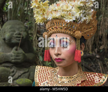 Balinese dancer with traditional makeup and eyes closed, Monkey Forest, Ubud, Bali Stock Photo