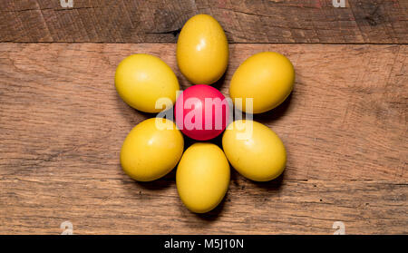 Pattern of painted eggs on wooden table for Easter Stock Photo