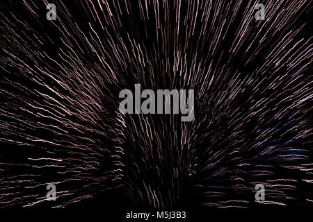trippy beams of long exposure lights or star trails Stock Photo