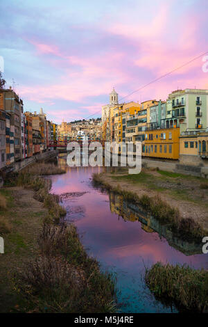 Spain, Catalunya, Girona, Cathedral and houses along the River Onyar in the evening Stock Photo