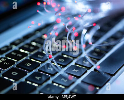 Fibre optics and tastatur of laptop Stock Photo