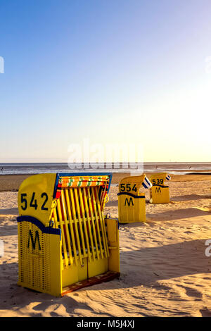 Germany, Schleswig-Holstein, Husum, closed hooded beach chair Stock Photo