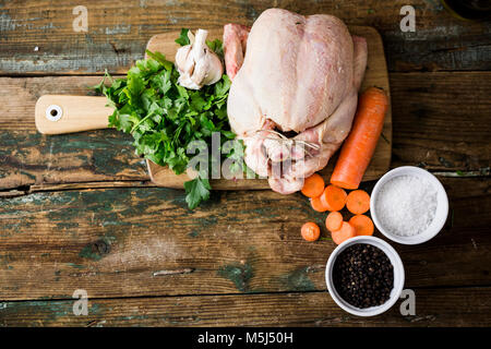Premium Photo  Raw chicken on a cutter board with vegetables and spices