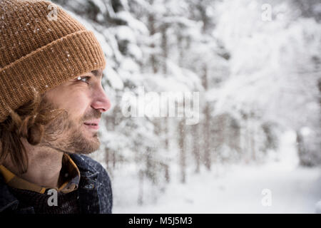 Portrait of man in winter forest Stock Photo