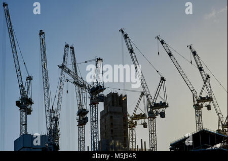 Abstract image of construction cranes silhouetted against the sky, on the South Bank in London Stock Photo