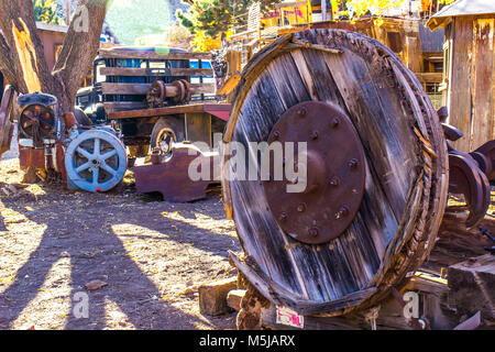 Vintage Wooden Wheels Once Used In Mining Operations Laying In Salvage Yard Stock Photo