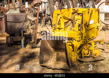 Vintage Rusty Yellow Scoop Once Used In Mining Ore Operations Stock Photo