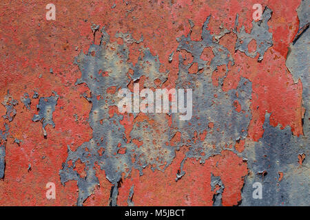 Beautiful grungy paint peeling from rusty metal background texture Stock Photo