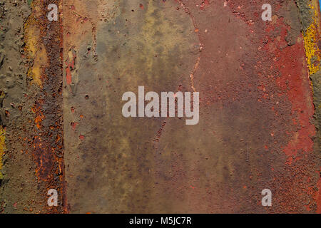 Peeling paint from rusty metal background texture Stock Photo