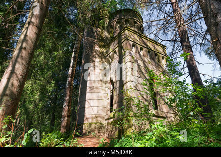 The time-destroyed romantic chapel-tomb (1914). Manor Zavetnoye. Novgorod Region, Russia Stock Photo