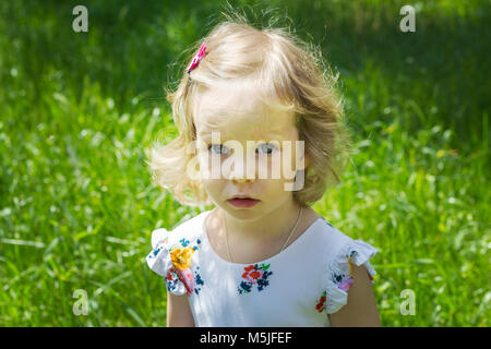 Pretty little girl walking in the Park. Stock Photo