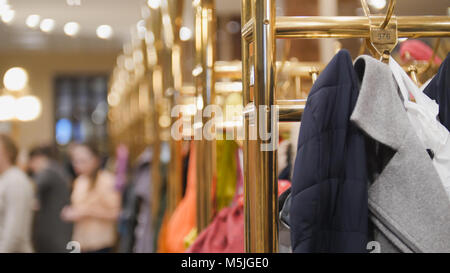 Wardrobe in hall of theatre -the audience pass the clothes in the closet Stock Photo