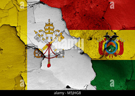 flag of Vatican and Bolivia painted on cracked wall Stock Photo
