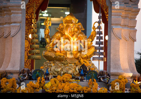 BANGKOK, THAILAND, MARCH 01, 2017 - Golden Ganesha god statue in front of the Central World Plaza. The elephant headed god who is the symbol of succes Stock Photo