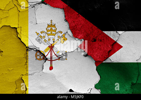 flag of Vatican and Palestine painted on cracked wall Stock Photo