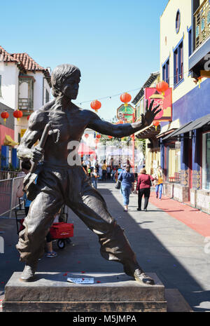 Chinese New Year 2018 in China Town Los Angeles, Ca. is celebrated with parades, crowds, and festivities. Bruce Lee statue stands in Chinatown square. Stock Photo