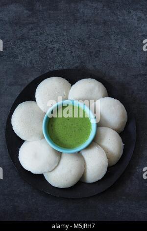 Idli / Idly food South Indian breakfast with chutney top view Stock Photo