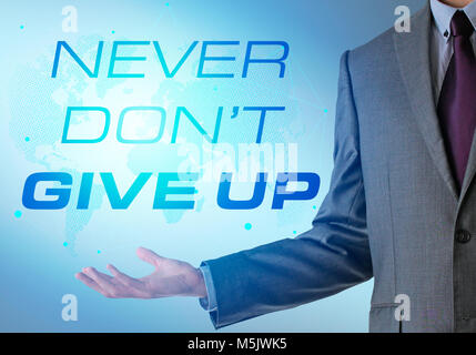 Inspirational motivating company quote with business man. Never don't give up Stock Photo