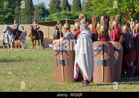 AQUILEIA, Italy - June 18, 2017 : Ancient Roman legionary soldiers after the conclusion of the final battle at the local annual historical reenactment Stock Photo