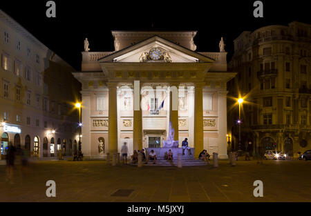 TRIESTE, Italy - August 3, 2017: Night view of the Palazzo della Borsa Vecchia in Piazza della Borsa in Trieste, Italy Stock Photo