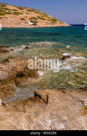 Rocky shoreline at Mochlos on the Mediterranean island of Crete Stock Photo